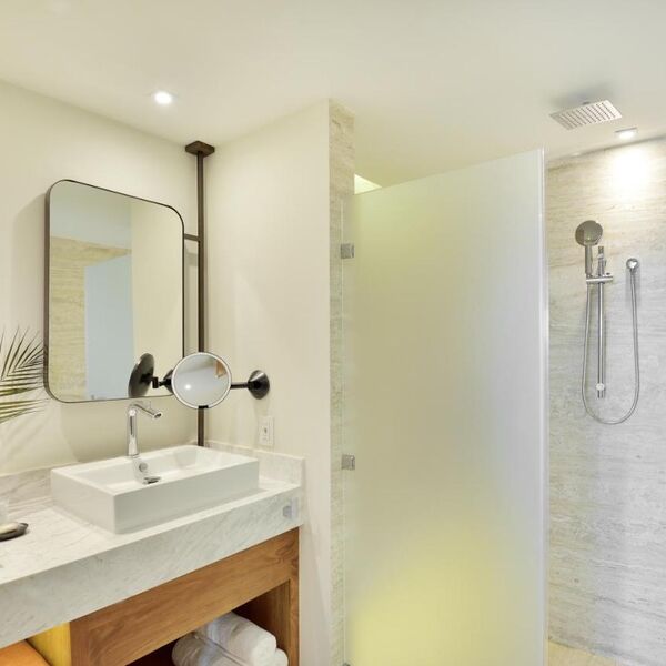 Modern spa-style bathroom with walk-in shower and elegant finishes