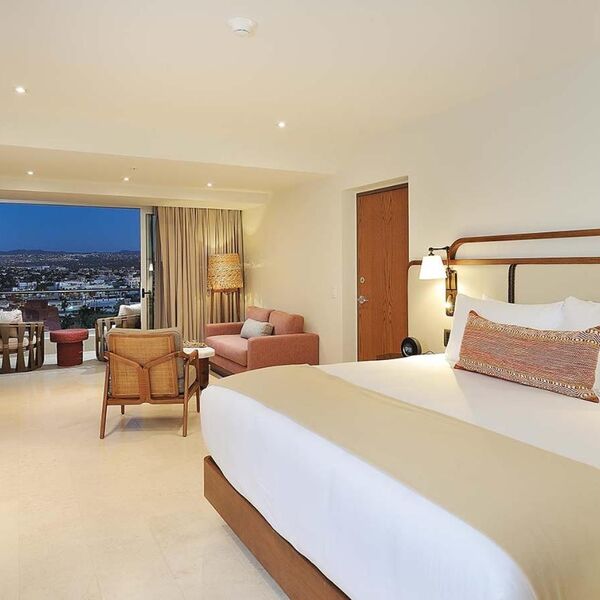 Spacious modern room with private balcony and stunning city views