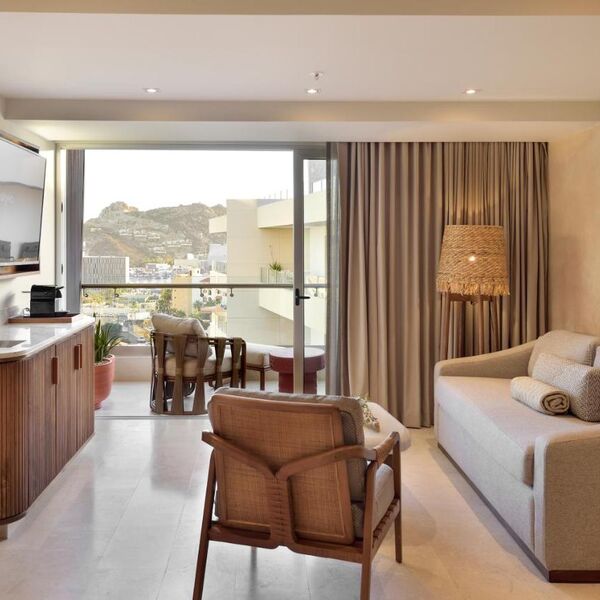 Bright modern suite with private balcony and scenic hillside views