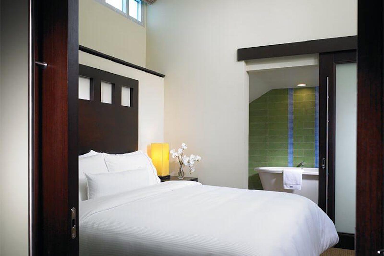 Modern suite with soaring ceilings and spa-like soaking tub
