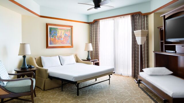 Bright, spacious room with sleeper sofa, daybed, and large sunny windows