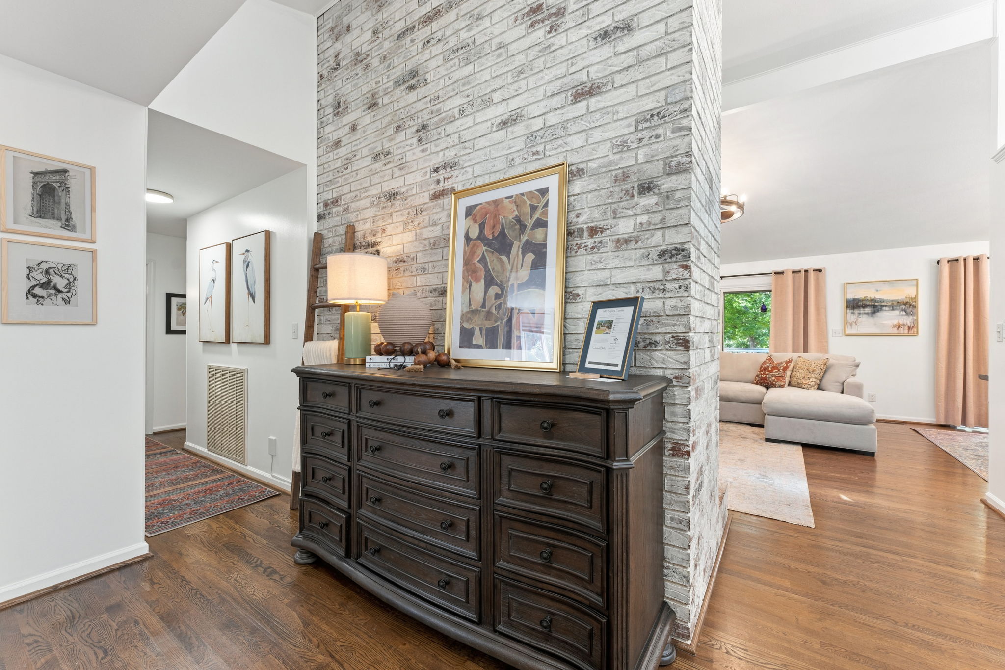 Enter through a statement brick wall and statement furniture