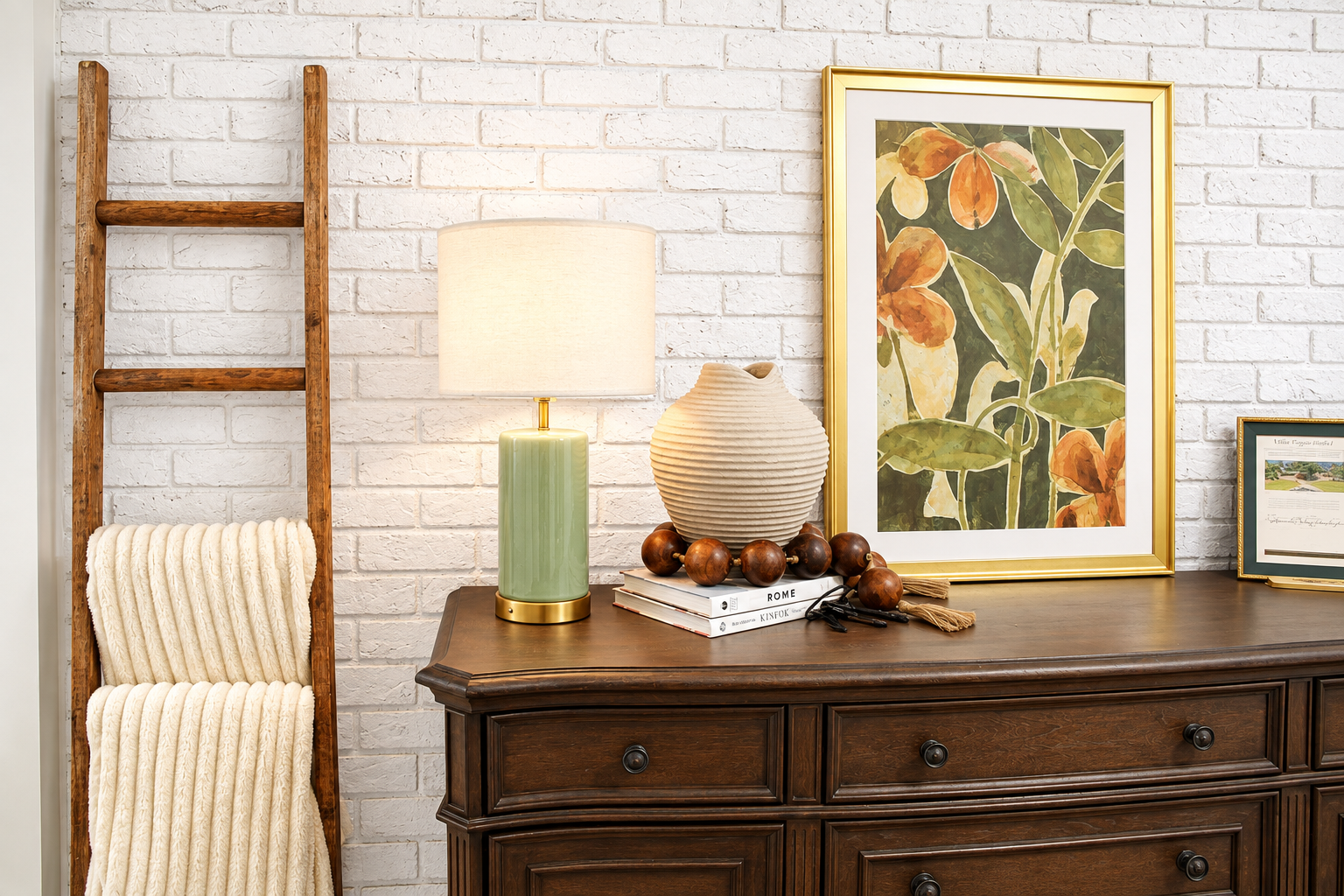 Cozy dresser nook with botanical art, warm lighting, and rustic charm