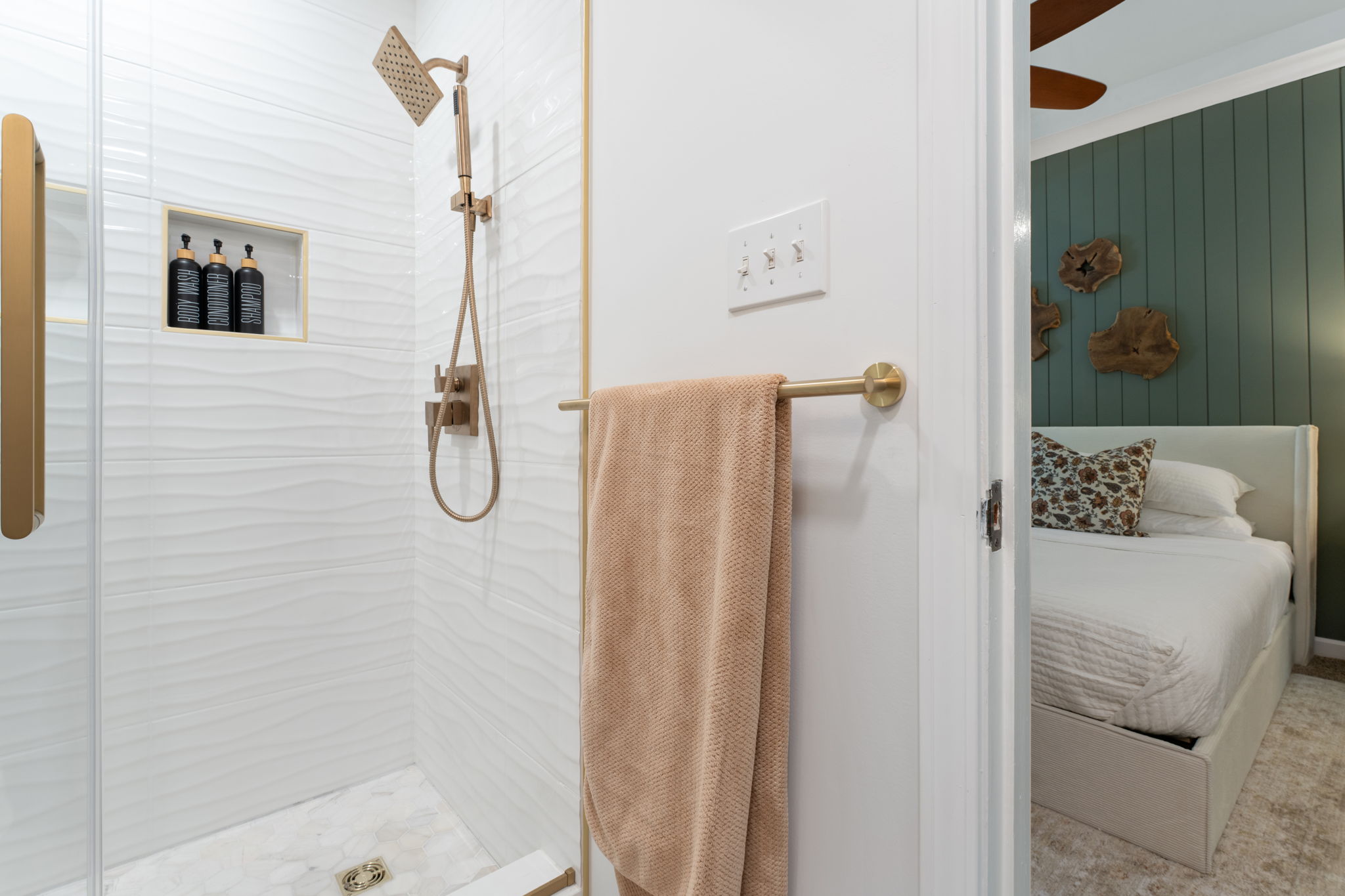 Spa-inspired bathroom with brass accents and sleek walk-in shower