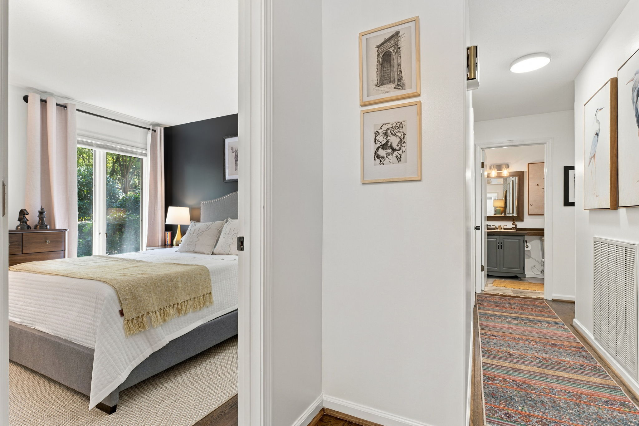 Bright bedroom hallway with stylish decor and easy bathroom access