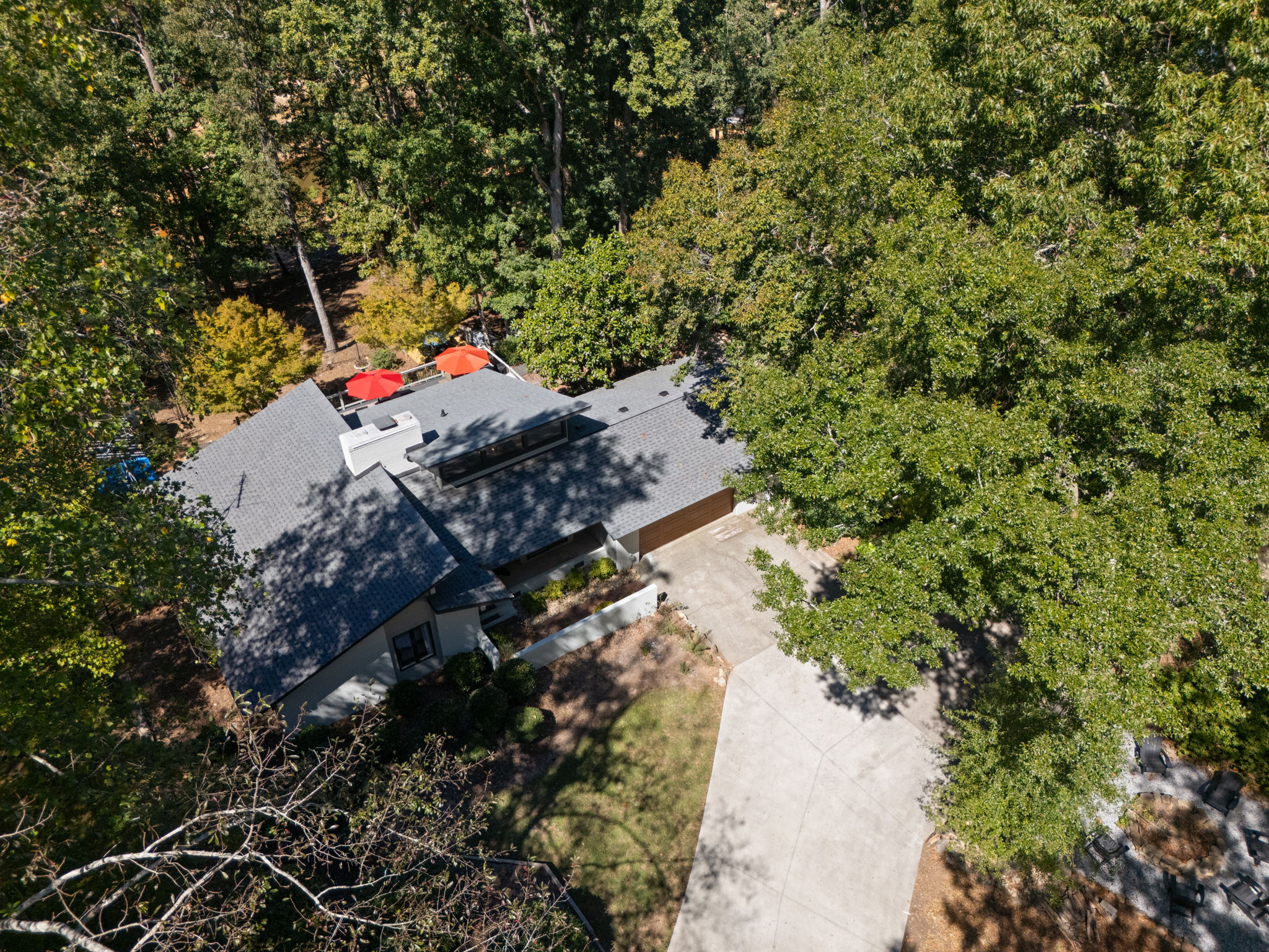 Private wooded retreat with spacious driveway and inviting outdoor space