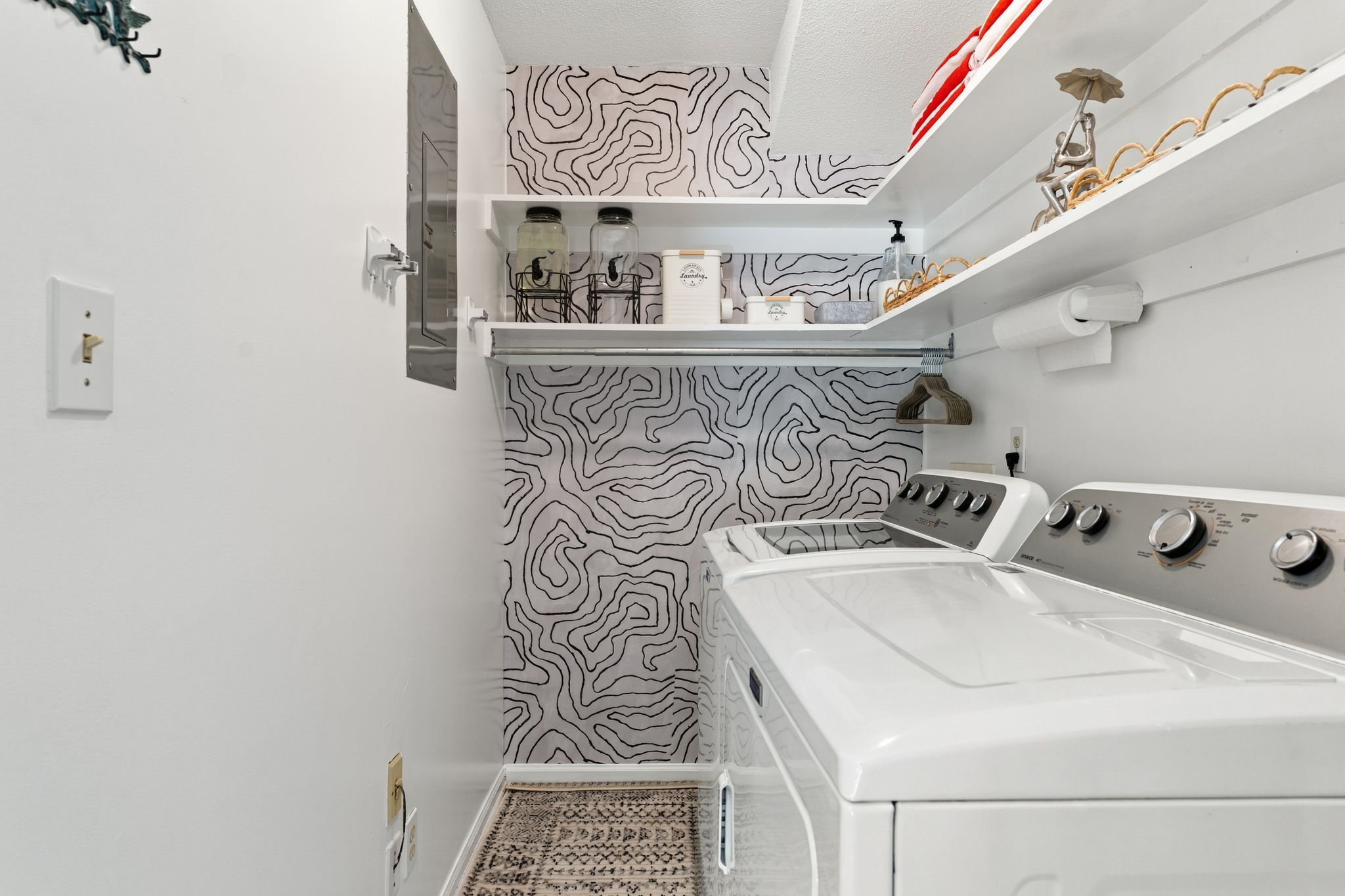 A designer laundry room stocked and ready, because even on vacation, you might want fresh linens.