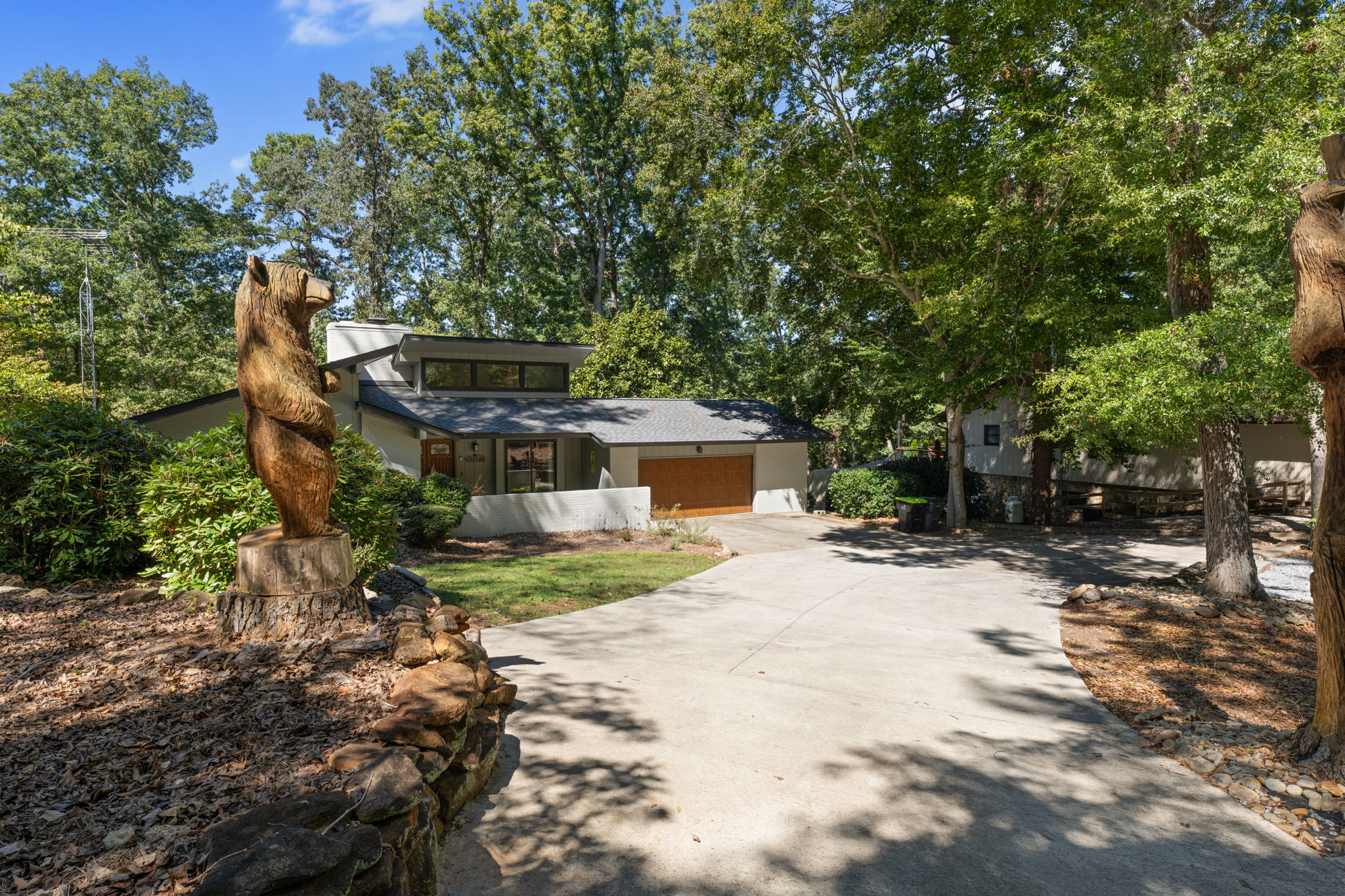 Where hand-carved bears greet you at the gate, and towering trees frame your private retreat.