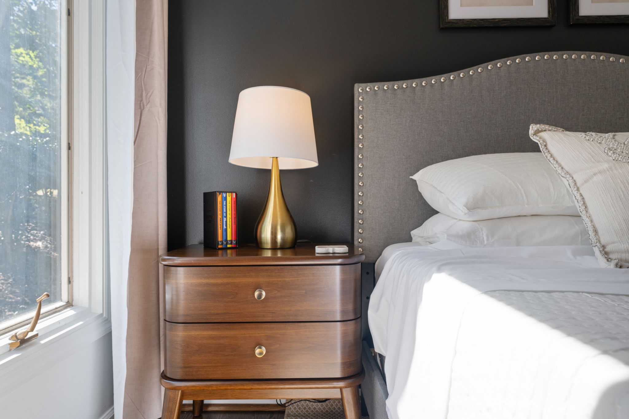 Bright, elegant bedroom with plush linens and stylish modern accents