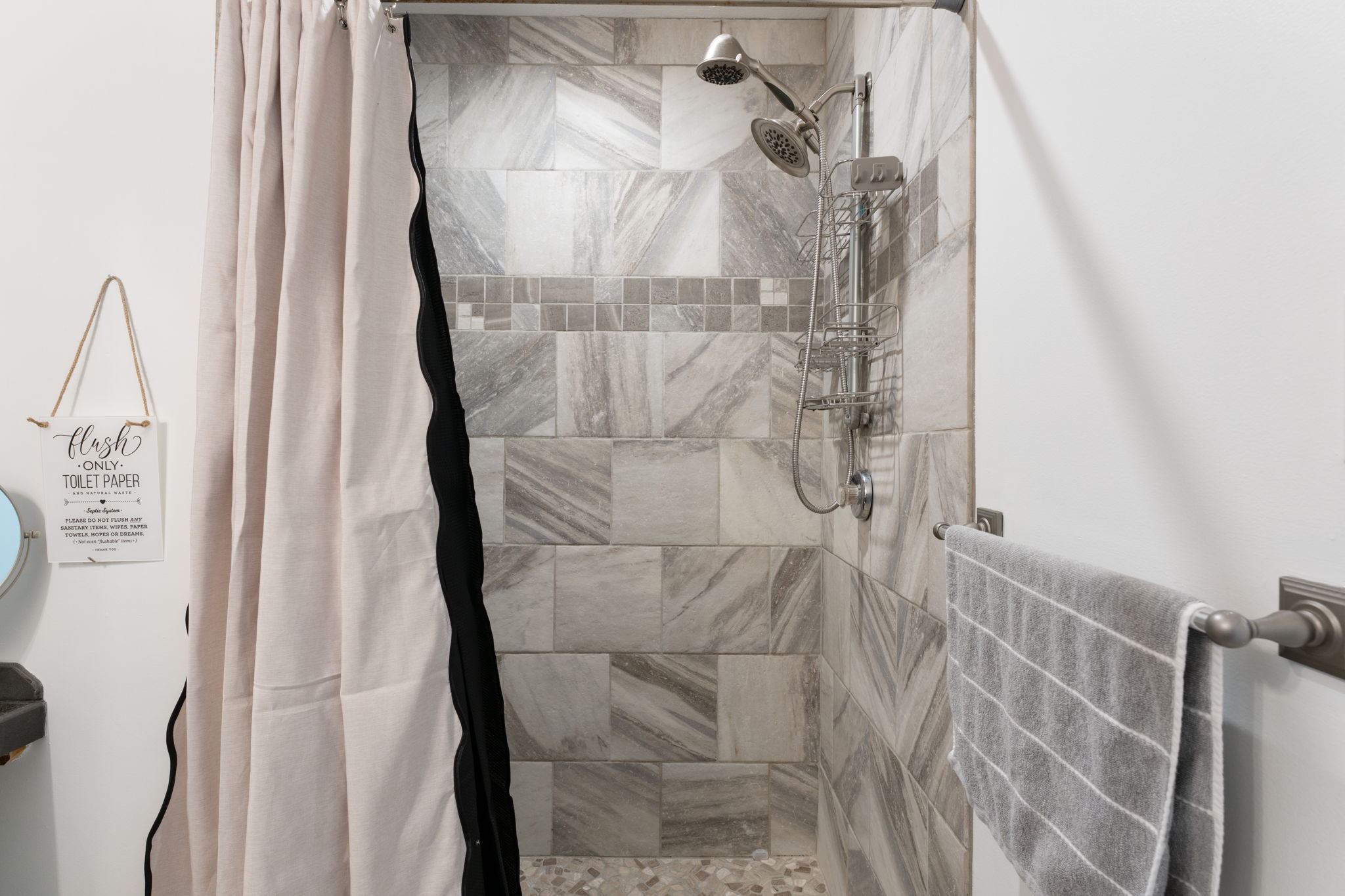 Spa-like tiled walk-in shower with rainfall and handheld showerheads