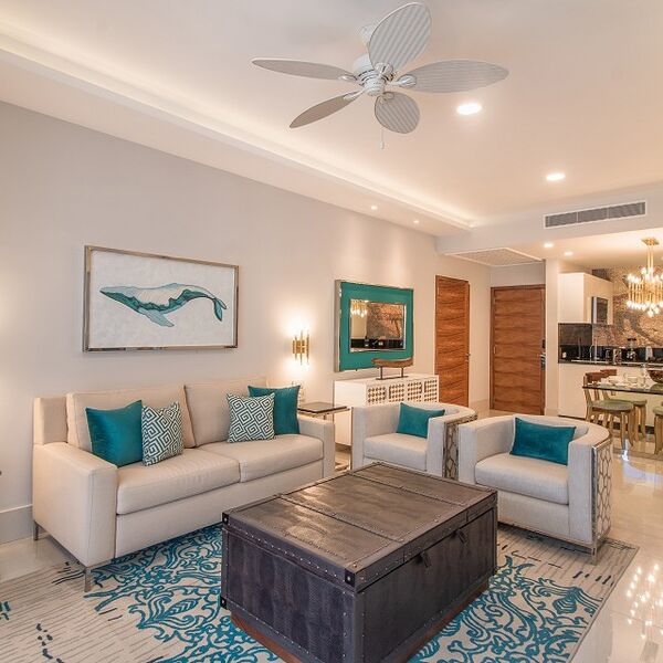 Bright coastal living room with chic seating and open-concept flow