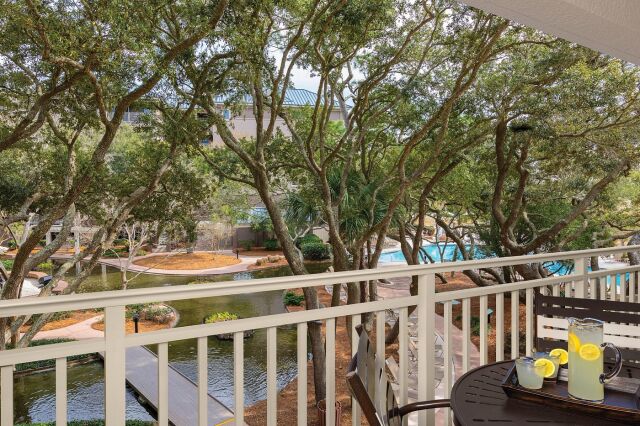Private balcony with tranquil water views and a peaceful, resort-style setting