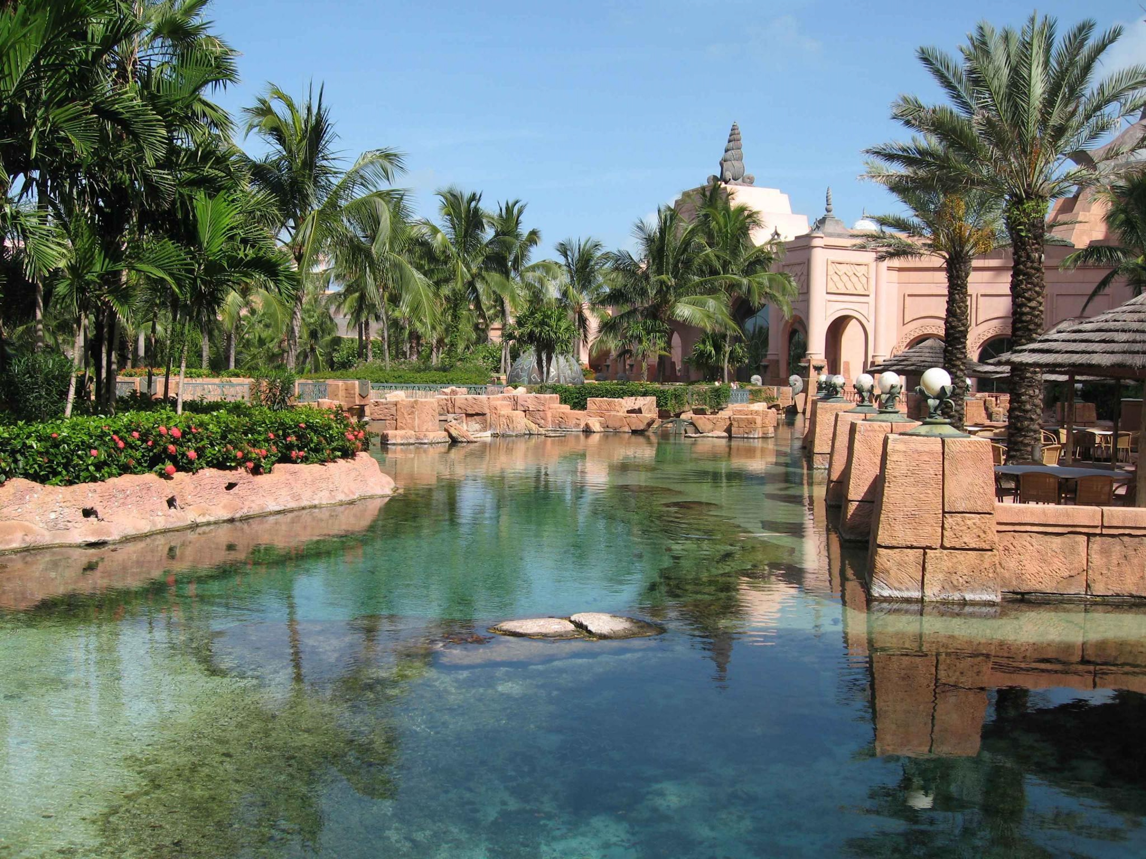 Tropical lagoon views with lush palms and elegant resort-style architecture