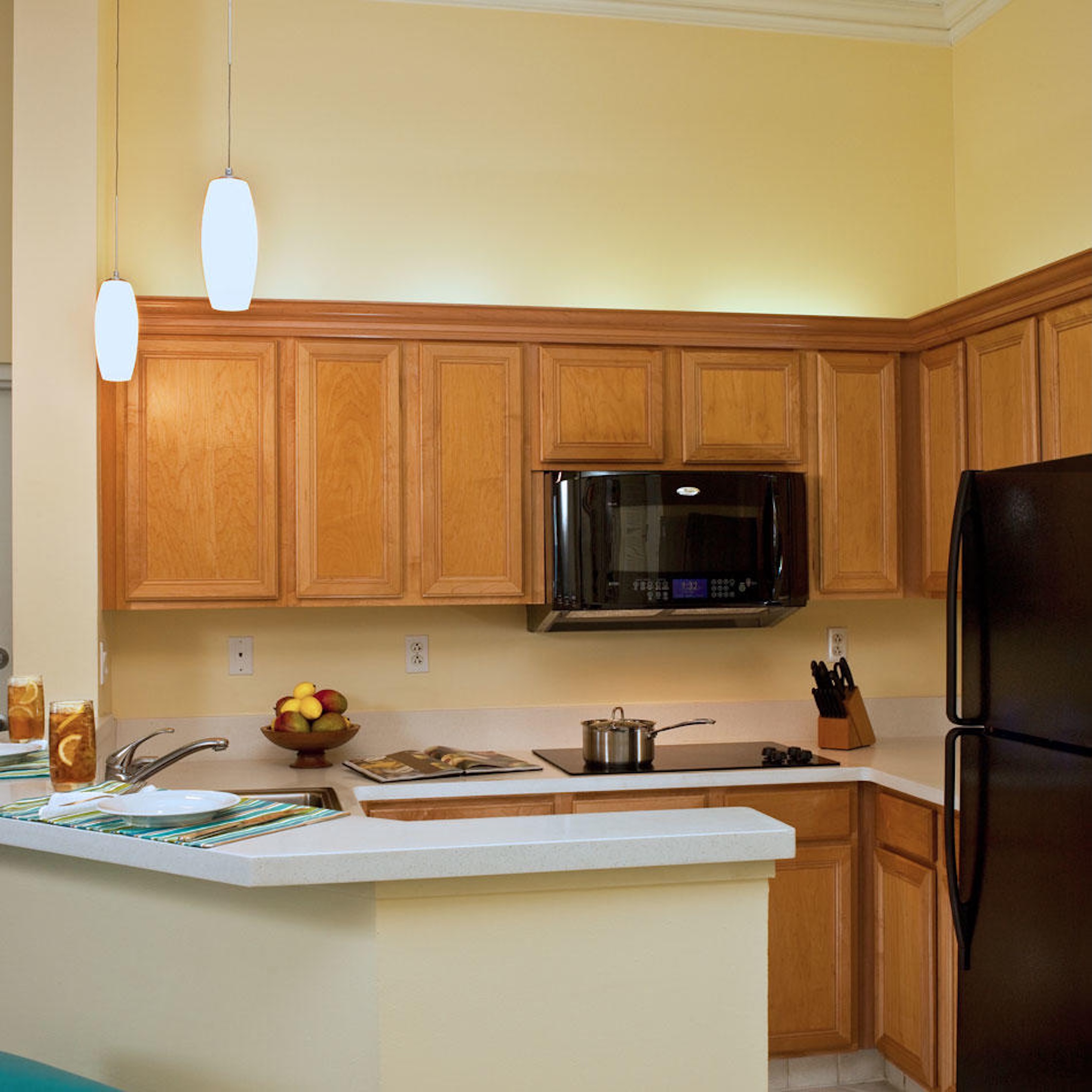 Bright kitchen with breakfast bar, pendant lighting, and ample counter space