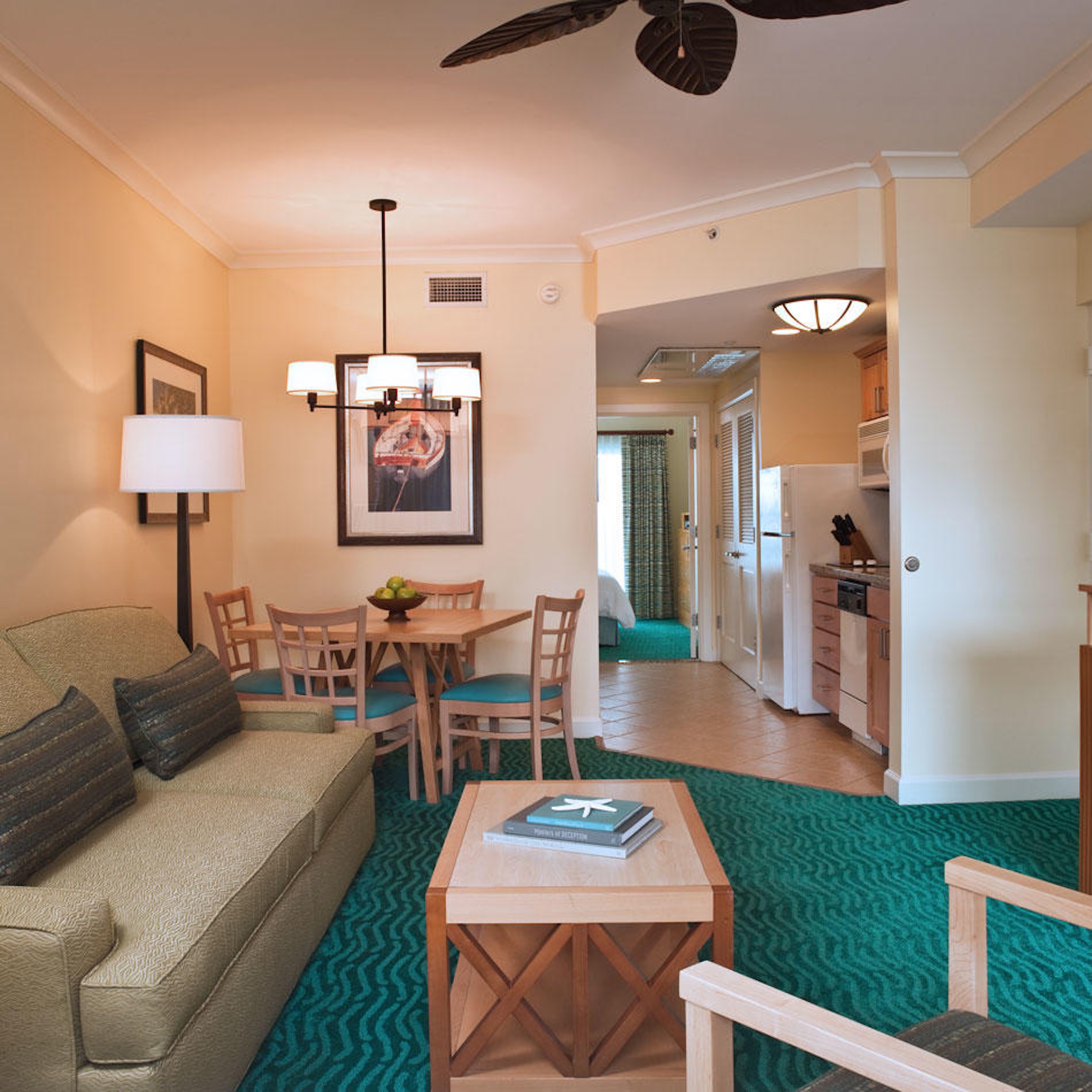 Bright coastal-style living area with dining nook and full kitchen