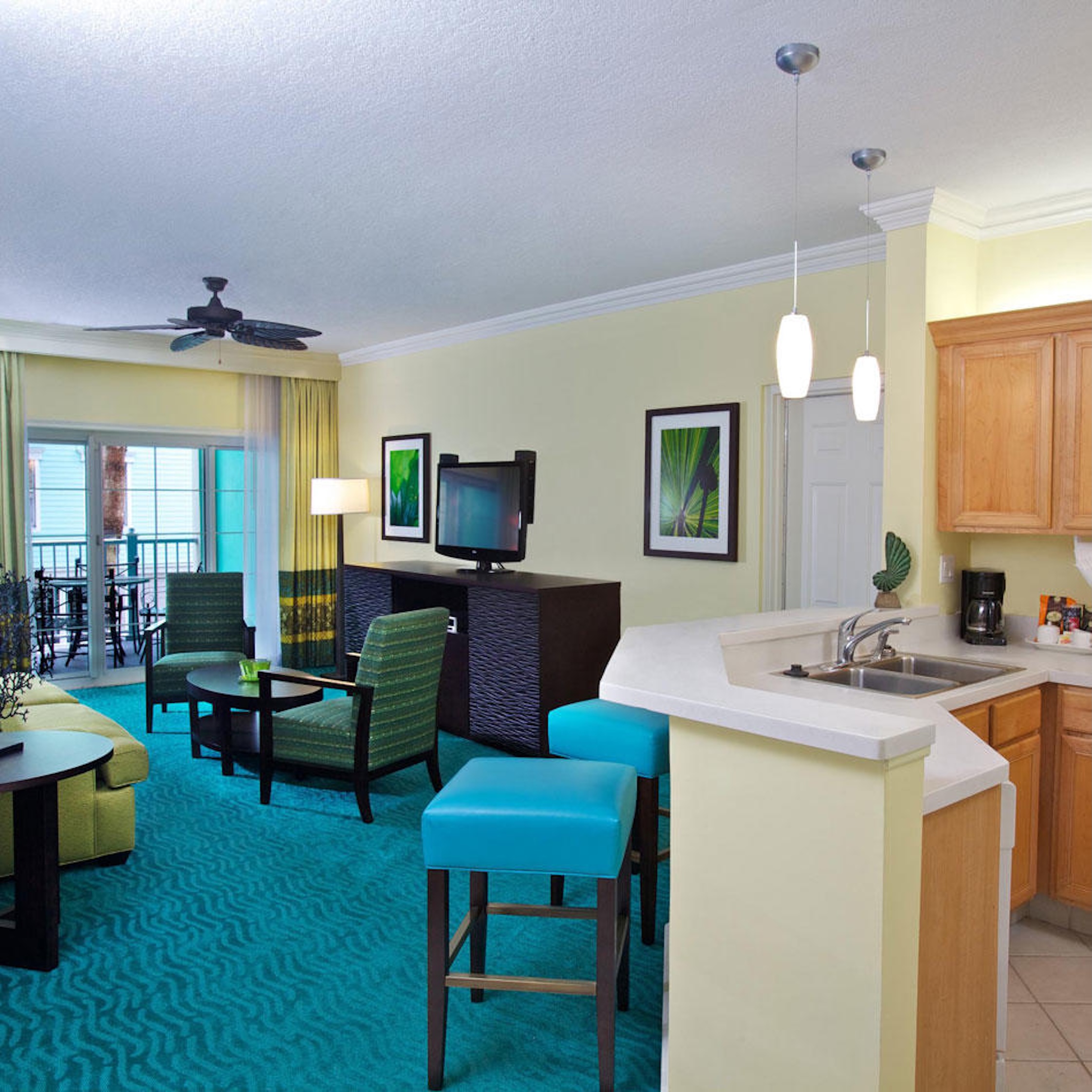 Bright open-concept suite with breakfast bar and private balcony