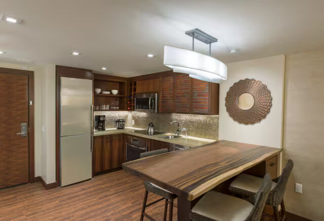 Stylish kitchenette with live-edge dining table and warm modern design