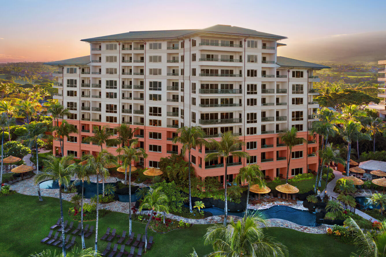 Tropical resort-style condo with lagoon pools and lush palm-lined grounds