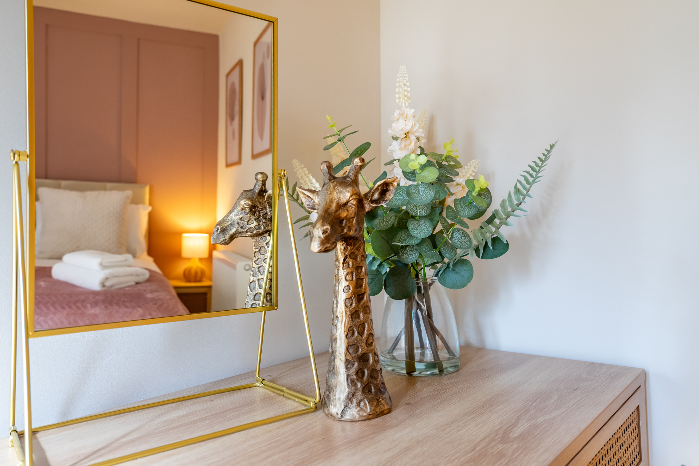 Stylish bedroom details with warm lighting and boutique-style decor