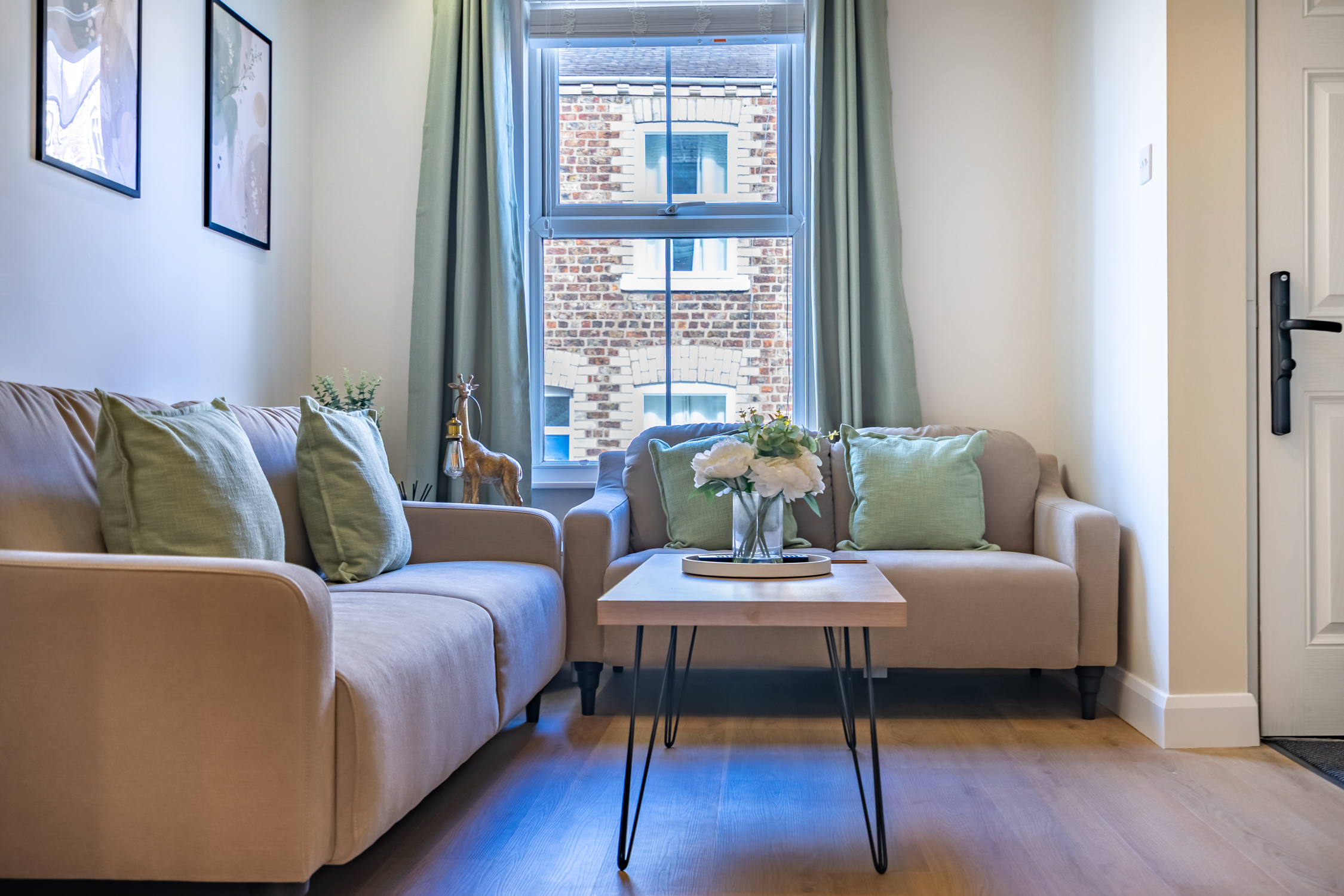 Bright and cozy lounge with natural light and stylish soft touches