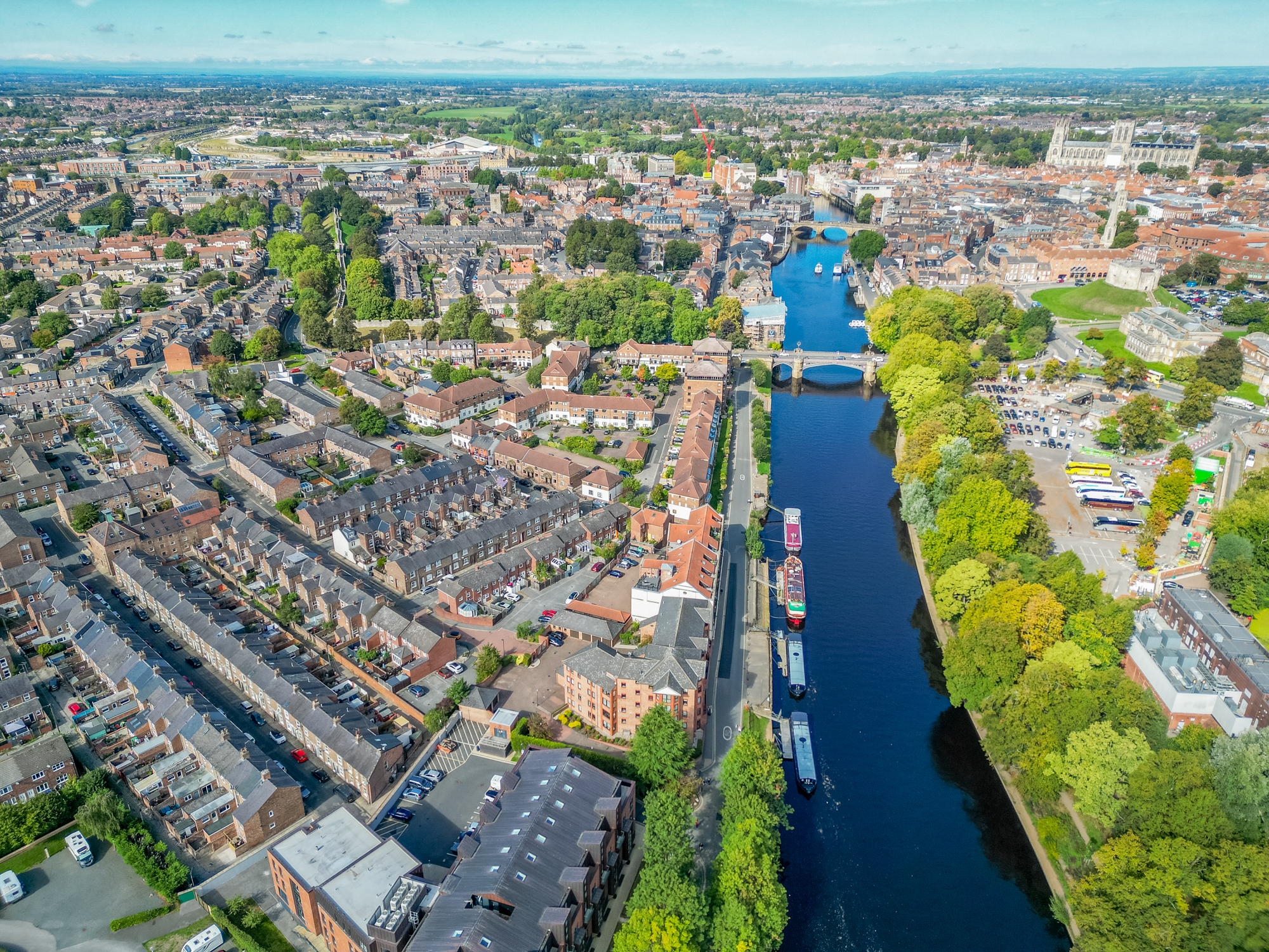 Scenic aerial view of the river, historic streets, and vibrant city center
