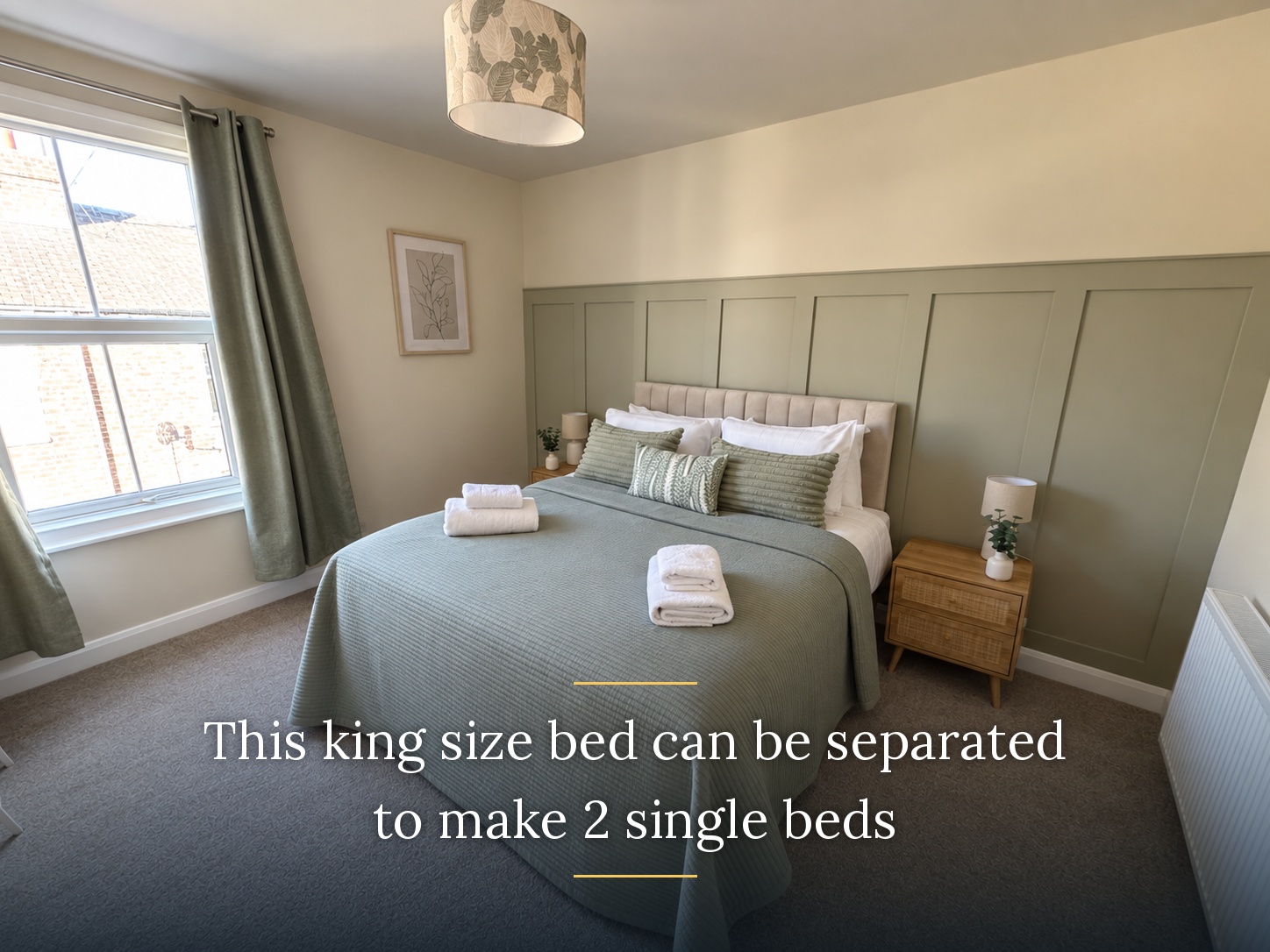 Flexible king bedroom with natural light and calming green tones