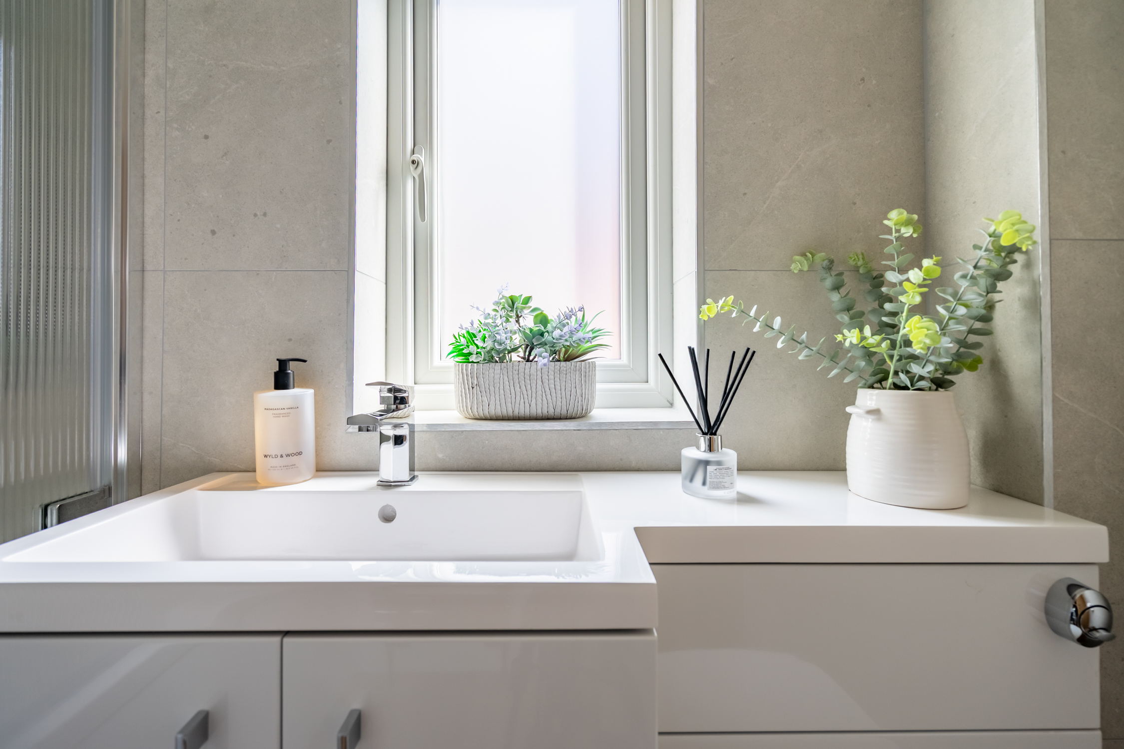 Bright modern bathroom with sleek vanity and spa-like touches
