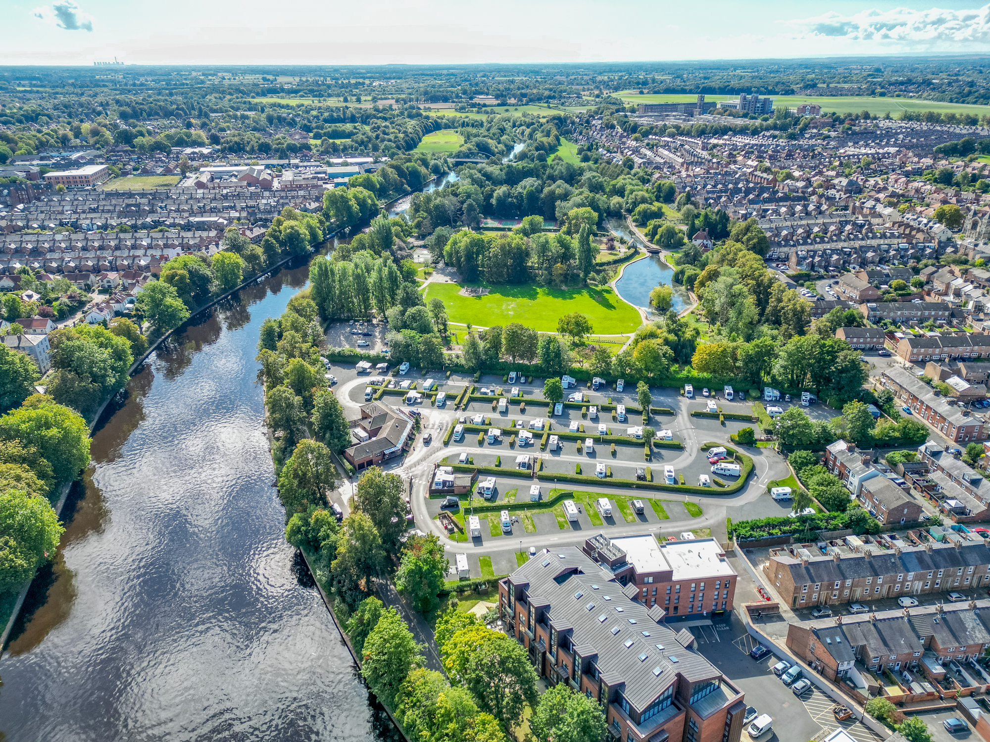 Scenic riverside holiday park beside lush green spaces