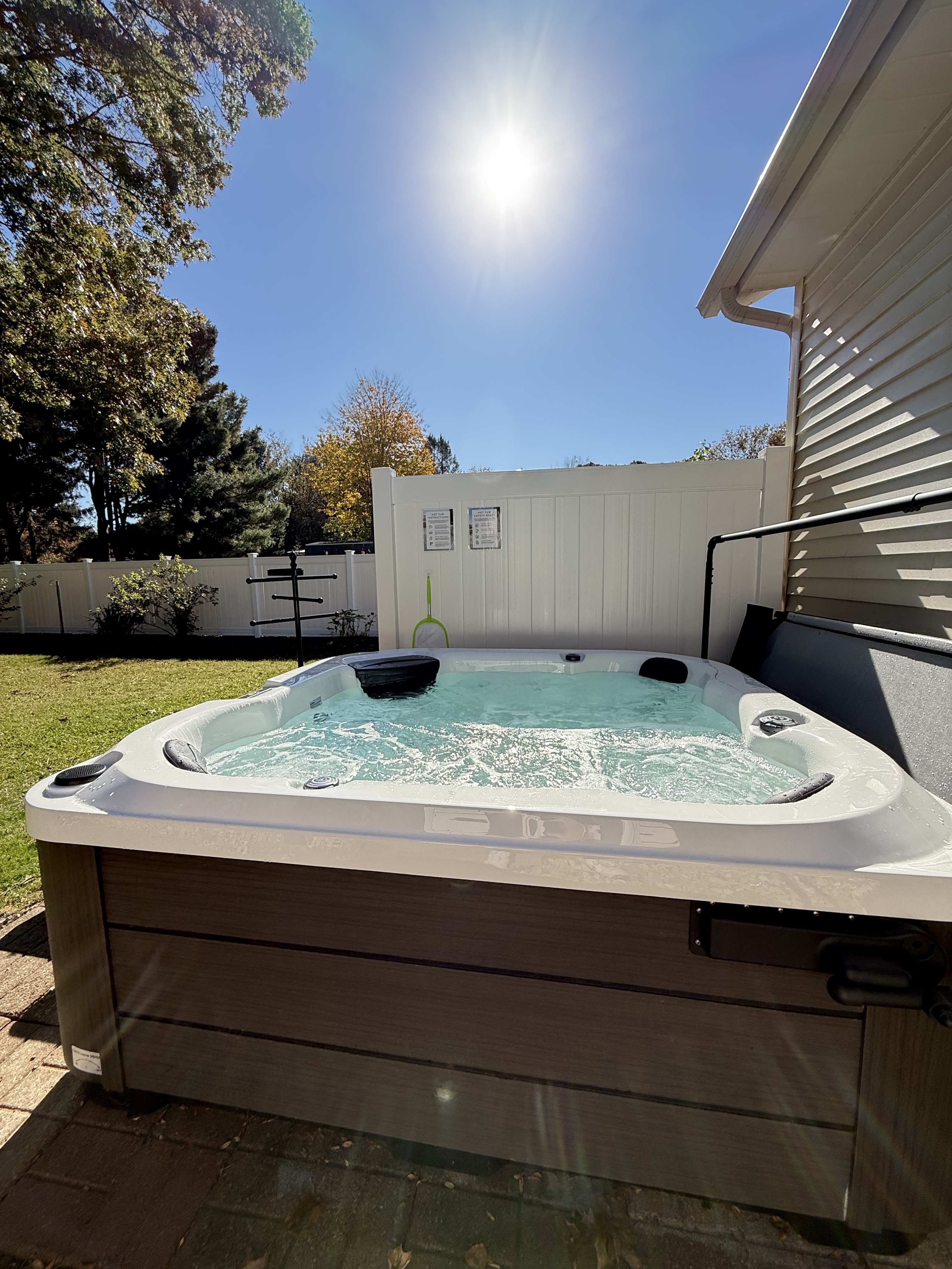 Private outdoor hot tub with sunny fenced yard for relaxing soaks