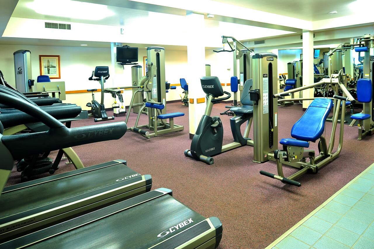 Bright, fully equipped fitness room with cardio and strength machines