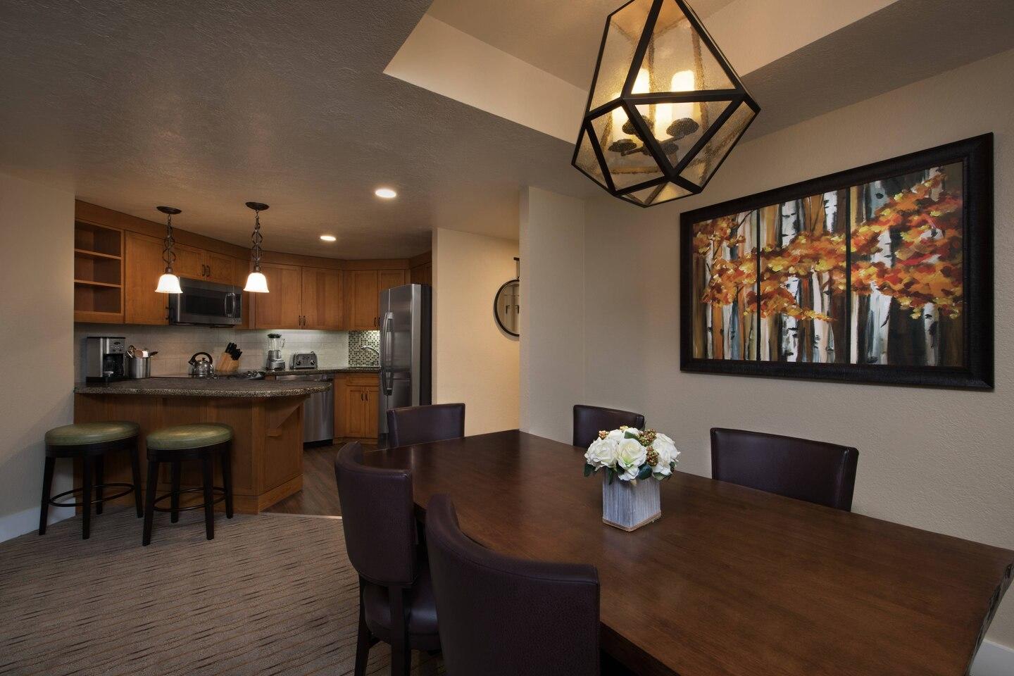Warm open dining area with full kitchen and breakfast bar seating