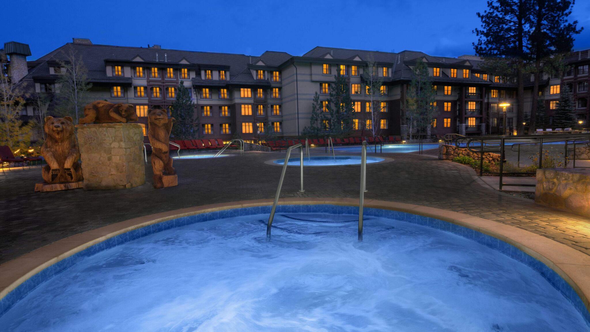Relax in the glowing hot tub at this cozy lodge-style mountain retreat