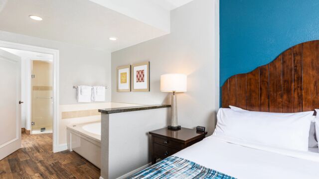 Bright bedroom with en suite soaking tub and stylish modern touches