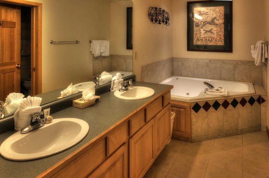Spacious spa-style bath with double vanity and relaxing soaking tub