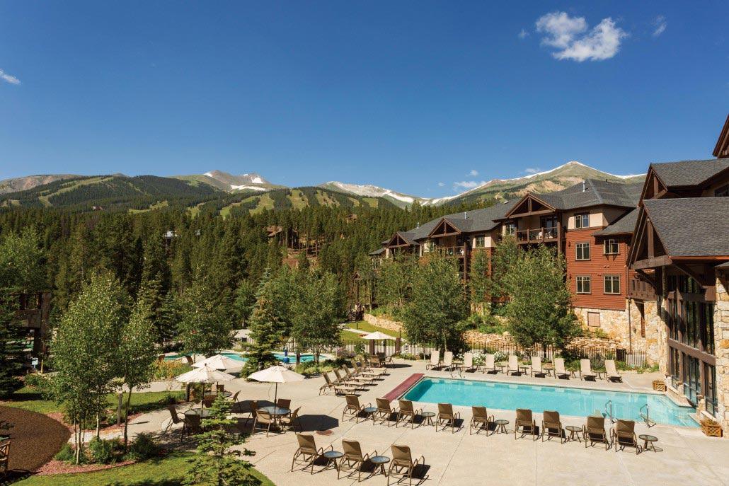 Resort-style pool with mountain views and a peaceful alpine setting
