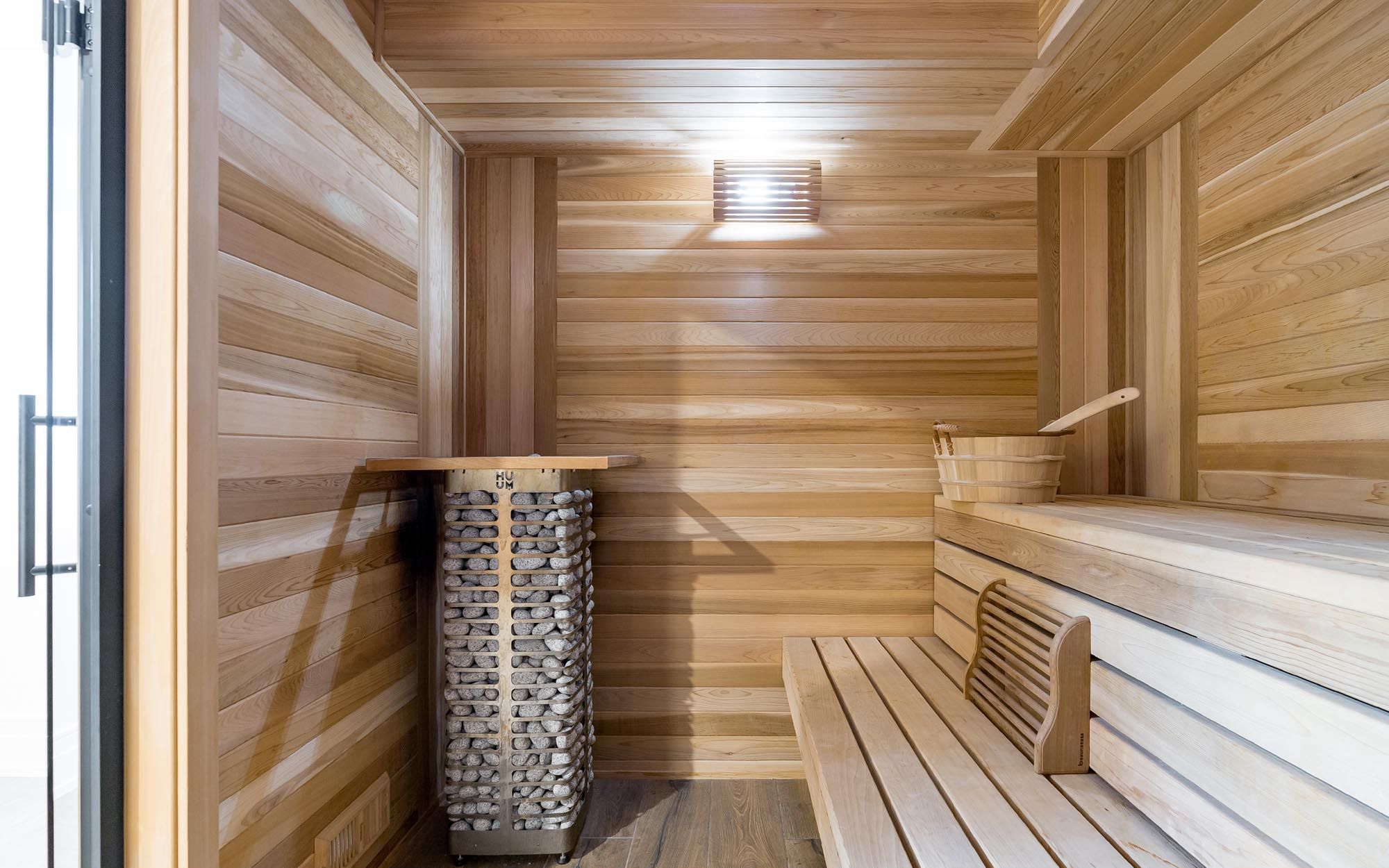 Cedar sauna with a stone heater at Blue Bird Lakehouse on Lake St. John in Orillia