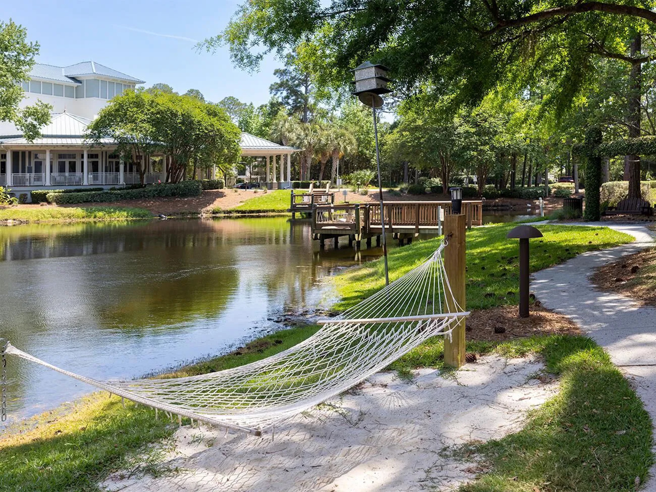 Relax by the water in a hammock with scenic paths and peaceful pond views