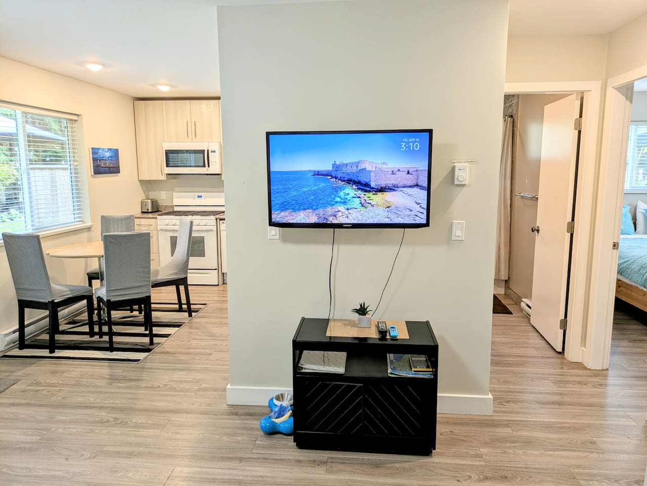 The open living room, dining room, and kitchen.