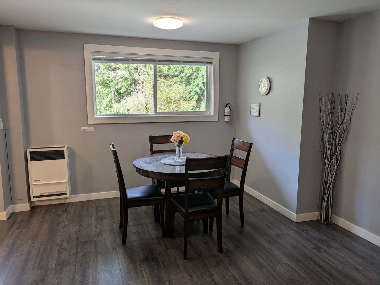Dining room table with four chairs.