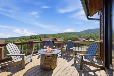 Sink into the Adirondack chairs on the mountain-view deck and let the fire table crackle as golden light fades over the ridgeline — the perfect spot to unwind, sip something warm, and watch the High Country come alive at dusk.
