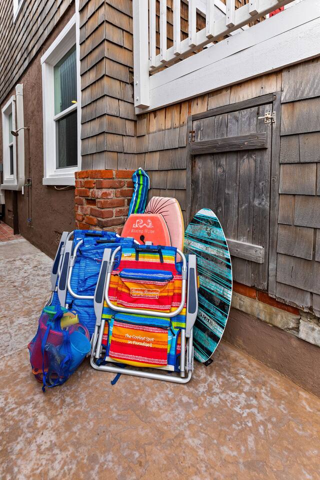 Umbrella, beach chairs, boogie boards and sand toys available.