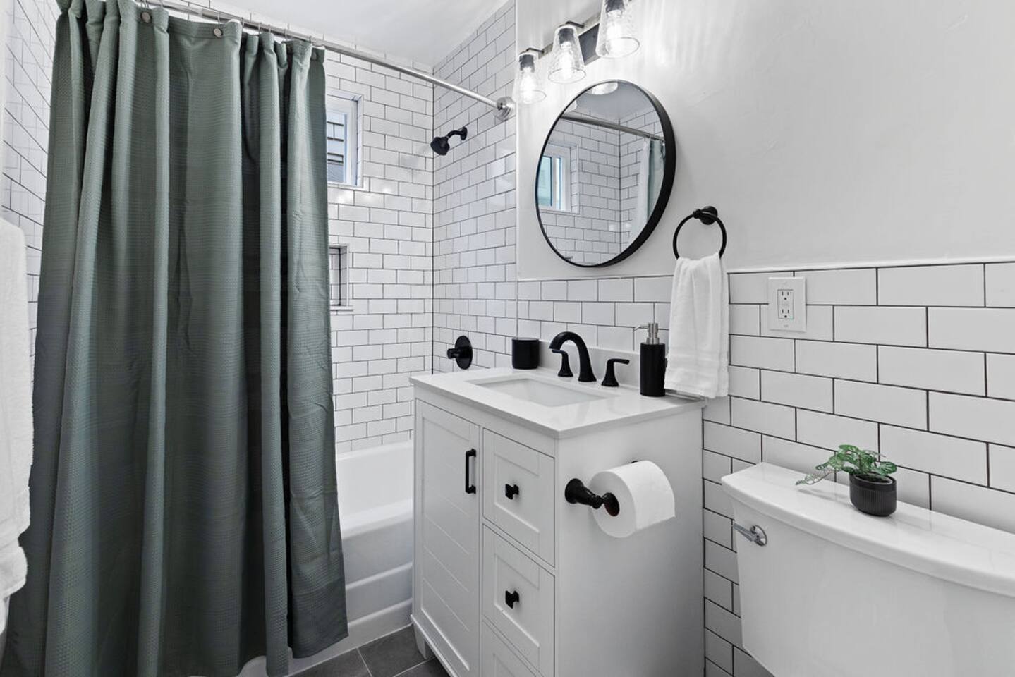 Bathroom #1. We provide shampoo, conditioner and body wash for your convenience.
