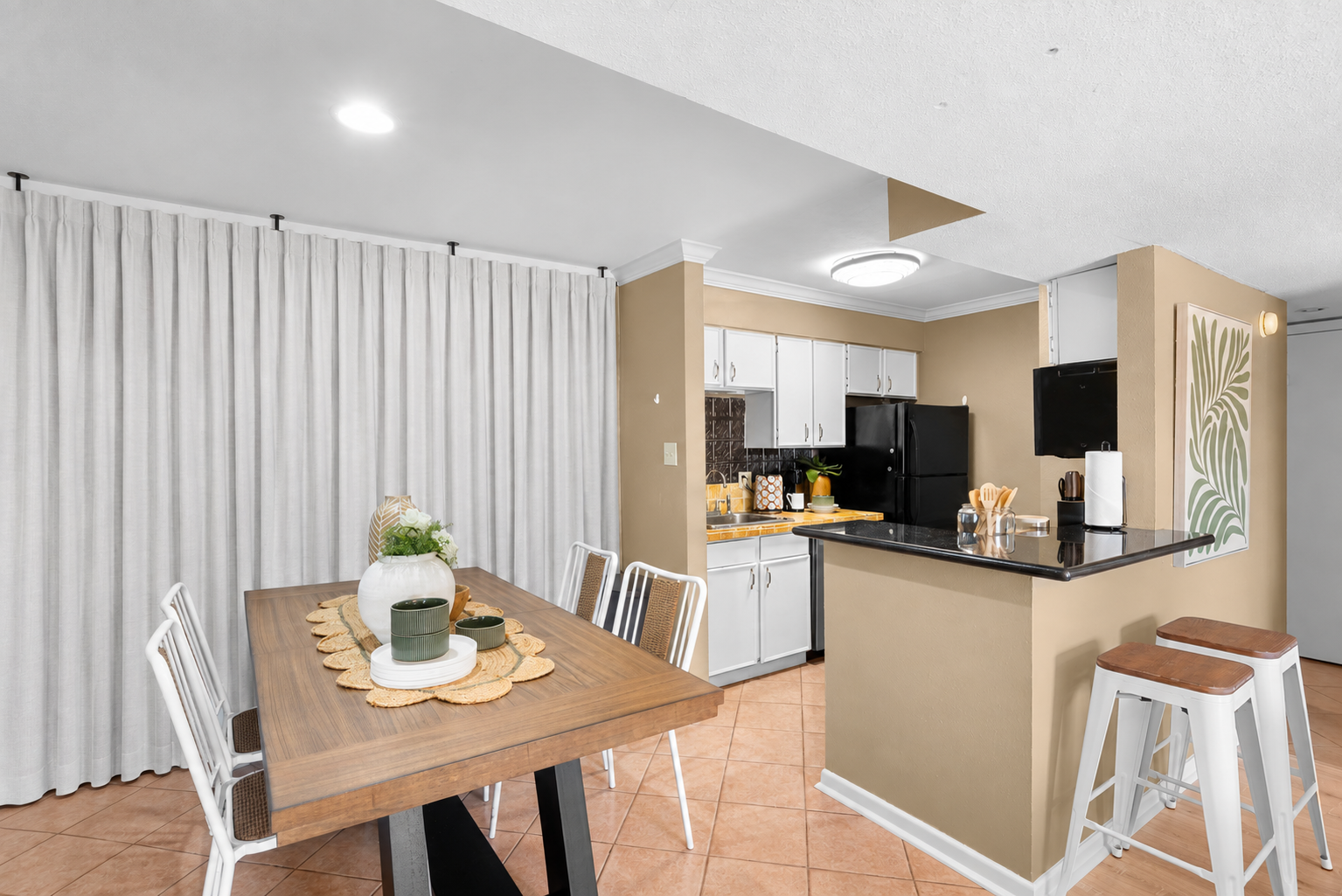 Bright dining area with breakfast bar and fully equipped kitchen