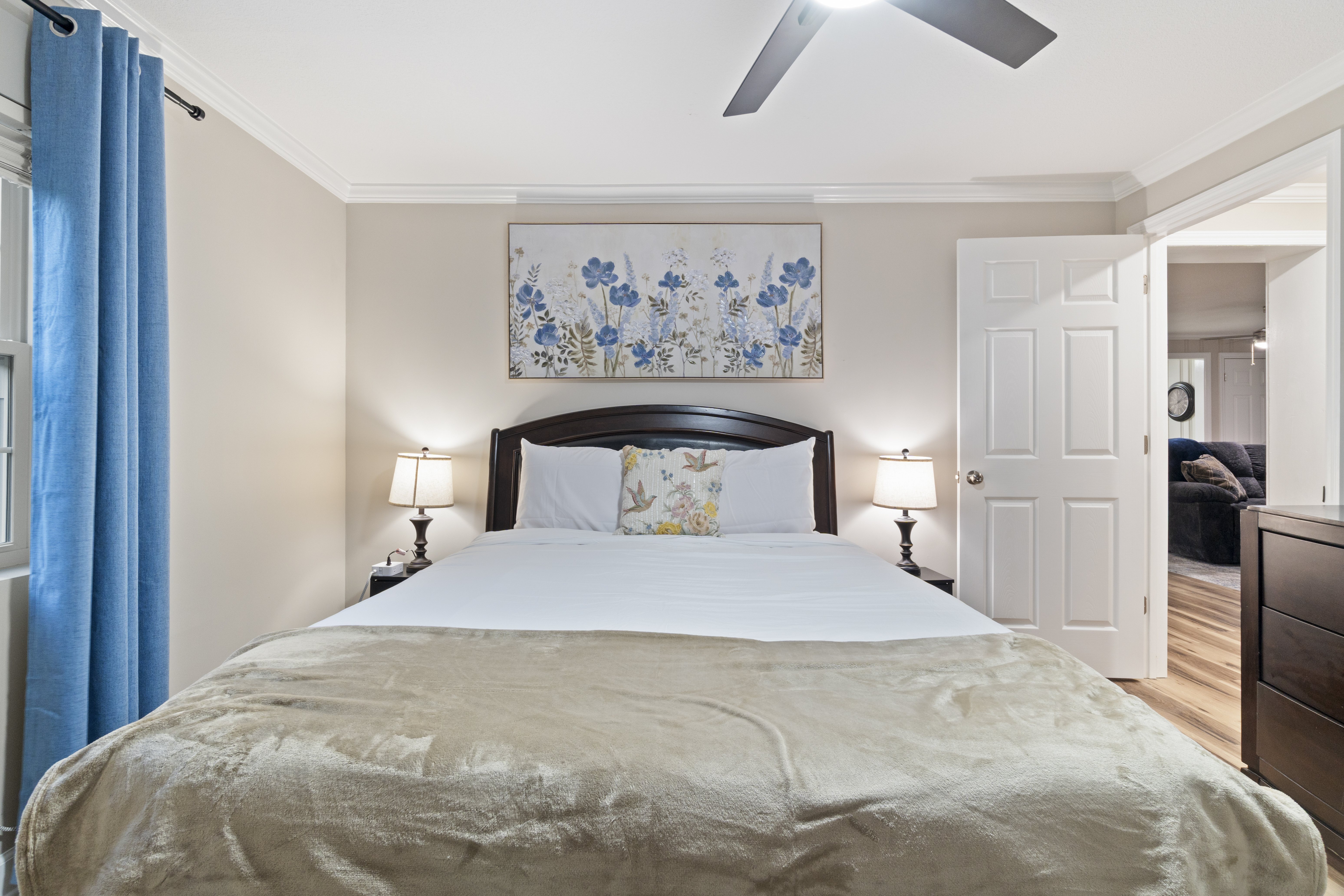 Cozy, elegant bedroom with soft lighting and stylish floral touches
