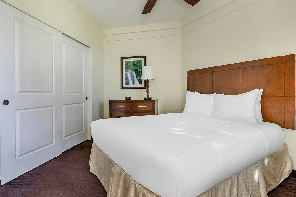 Bright, cozy bedroom with plush king bed and ample closet storage