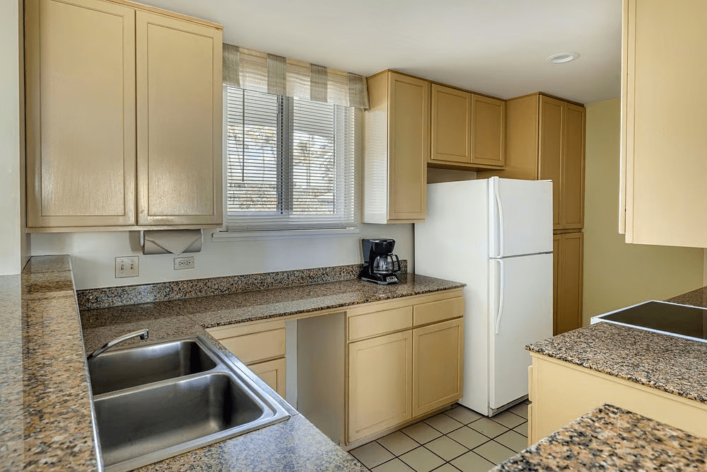 Bright kitchen with ample counter space, storage, and natural light