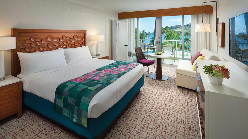 Bright king room with private balcony and stunning ocean views