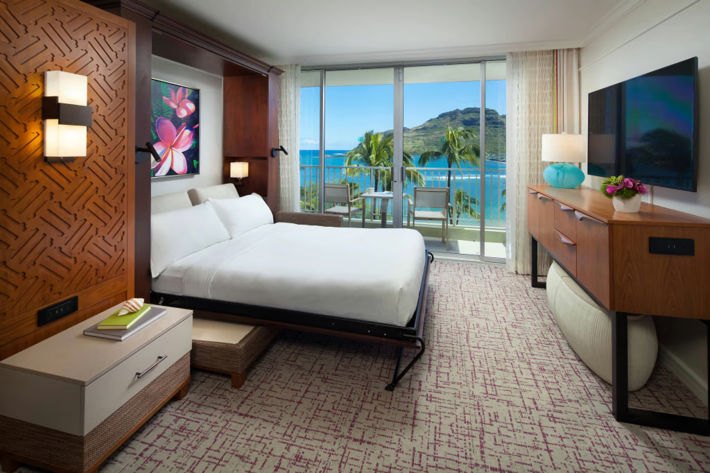 Modern oceanview bedroom with private balcony and stunning tropical scenery