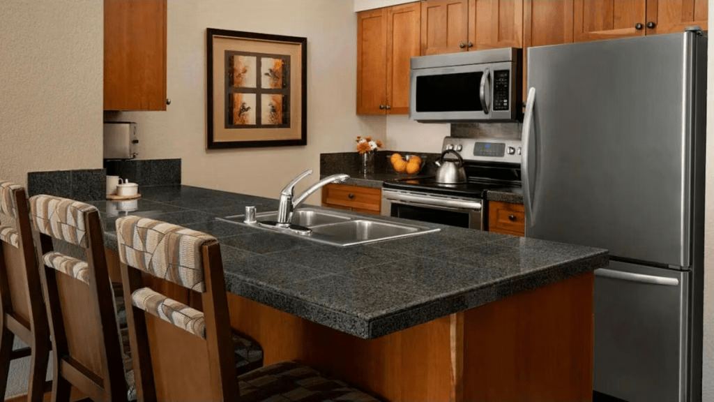 Modern kitchen with island seating and stainless steel appliances
