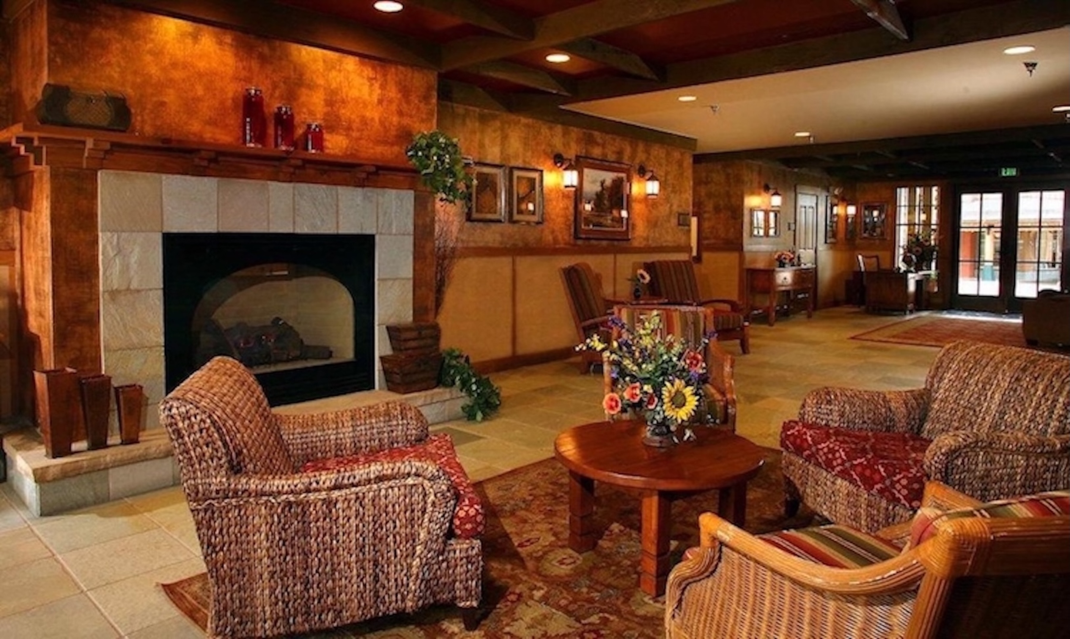 Cozy lodge-style lobby with fireplace and inviting lounge seating